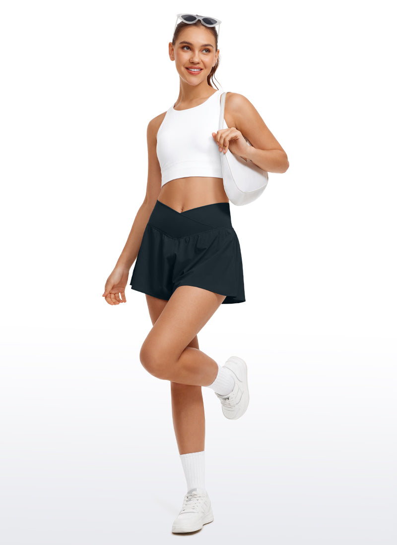 CRZ YOGA Women's Tennis V Crossover 2 in 1 Flowy Shorts High Waisted True Navy @model_info:Irina