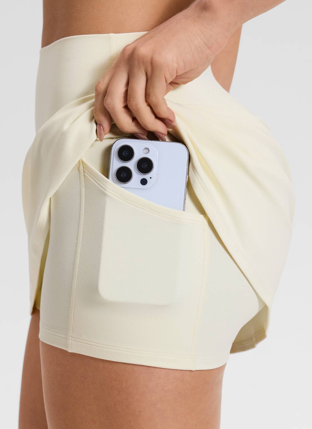CRZ YOGA Women's Butterluxe High Rise Tennis Skirts 14.5'' with Pocket Gloam Yellow Light @model_info:Aline