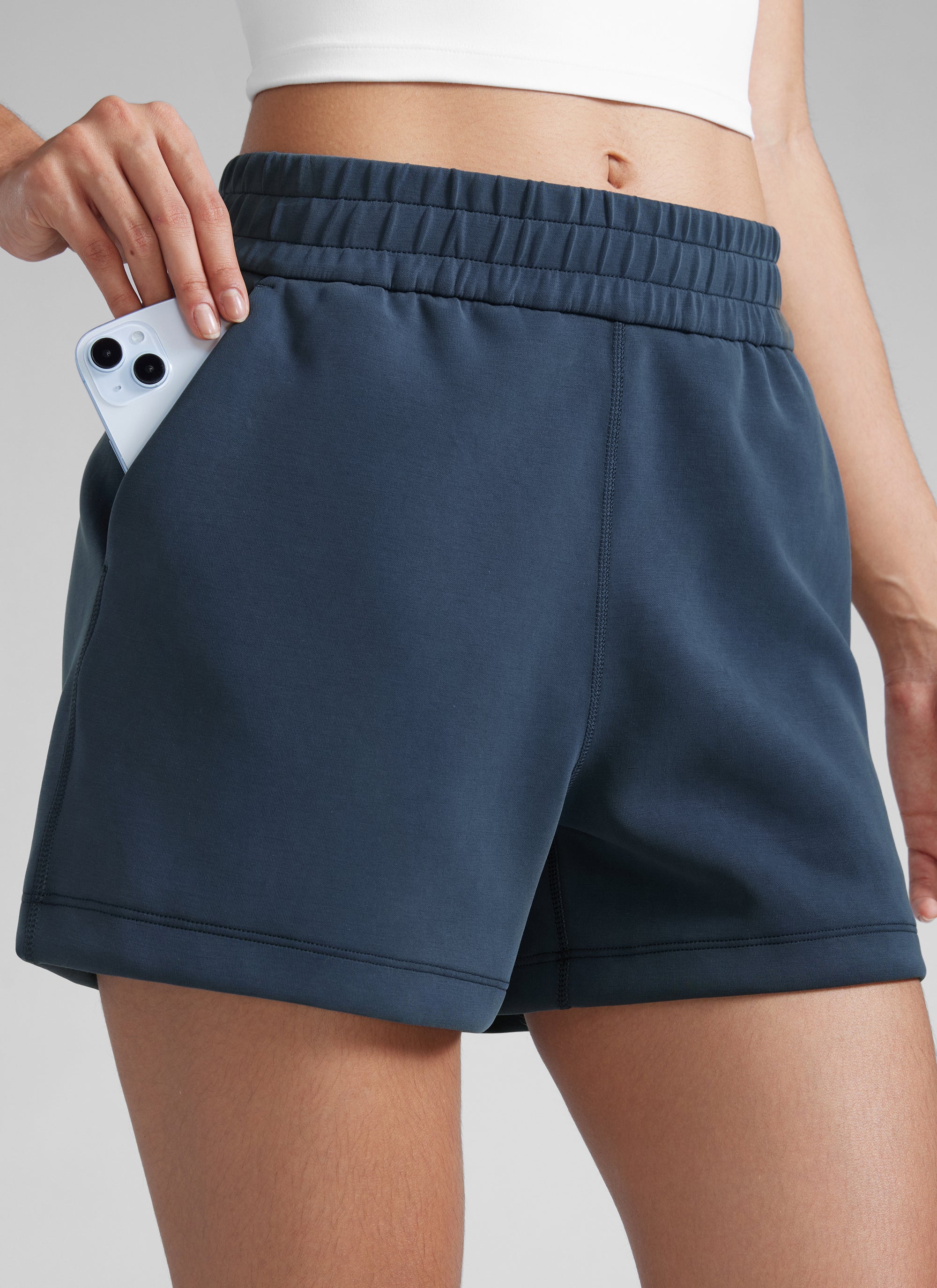 CRZYOGA Women SoftAura Sweat Shorts 4” with Pockets Drawstring Ink Blue @model_info:Paula