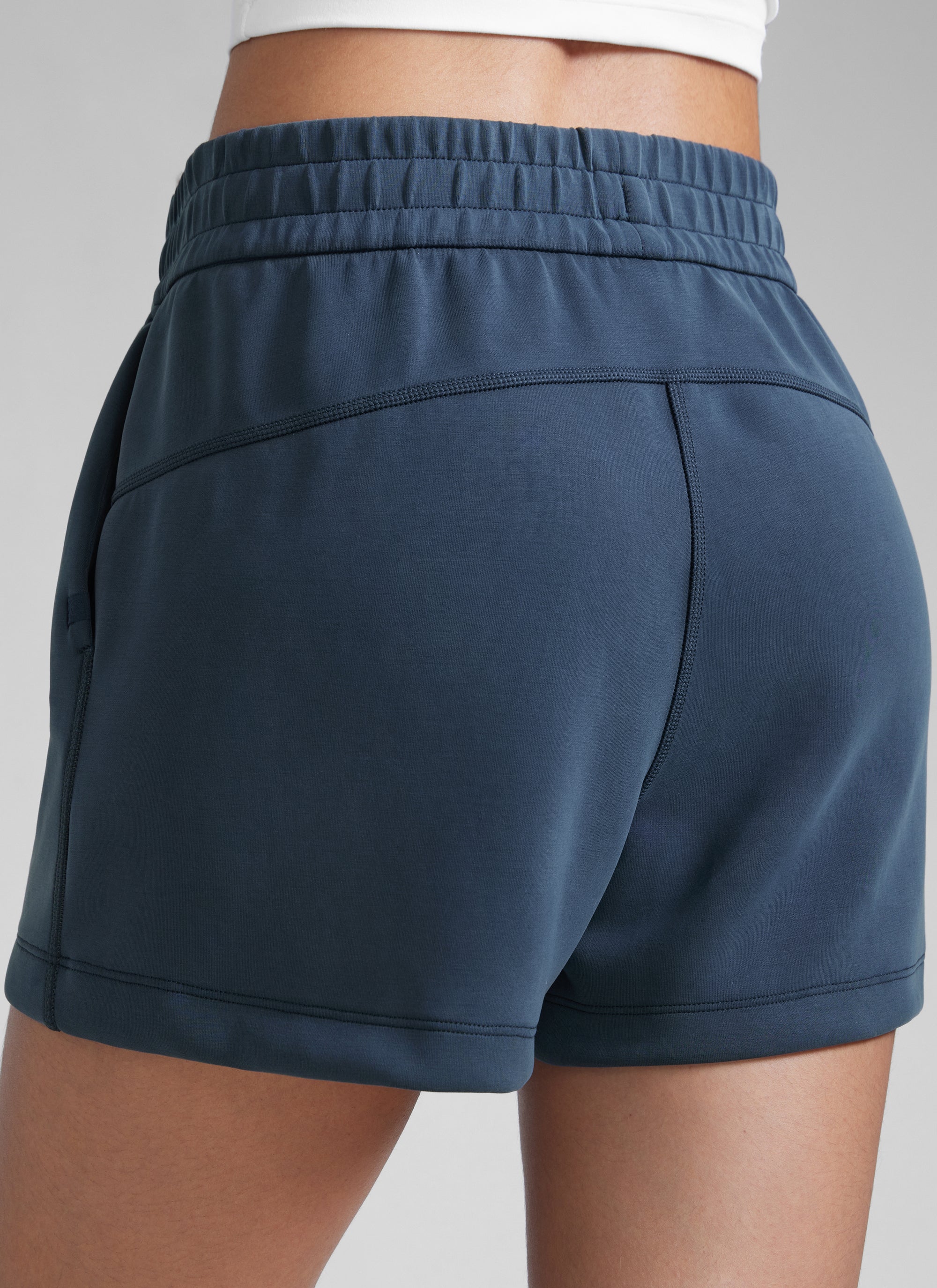 CRZYOGA Women SoftAura Sweat Shorts 4” with Pockets Drawstring Ink Blue @model_info:Paula