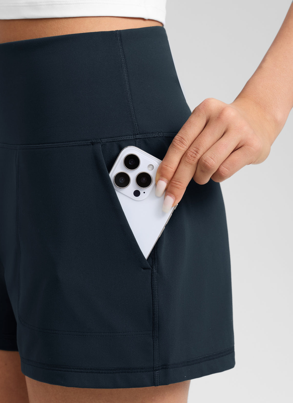 CRZ YOGA Women Butterlift High Waisted Shorts with Pockets Linerless True Navy @model_info:Anano