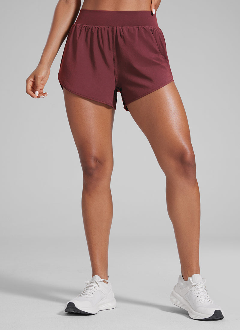 CRZ YOGA Women's High Waisted Dolphin Shorts 3” With Zipper Pockets Liner Red Merlot