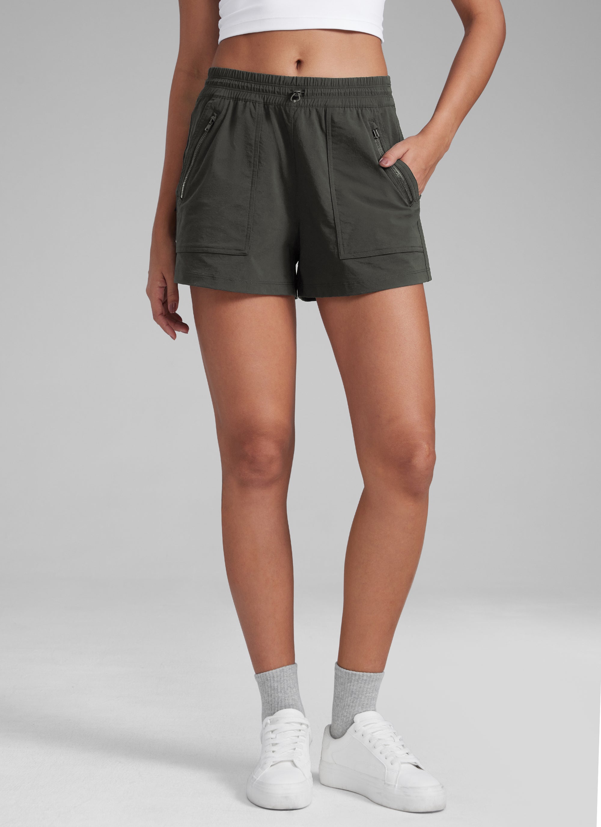 CRZYOGA Women's Lightweight Stretch Water-Repellent Hiking Pocket Short 3'' Arbor Olive @model_info:Jenna