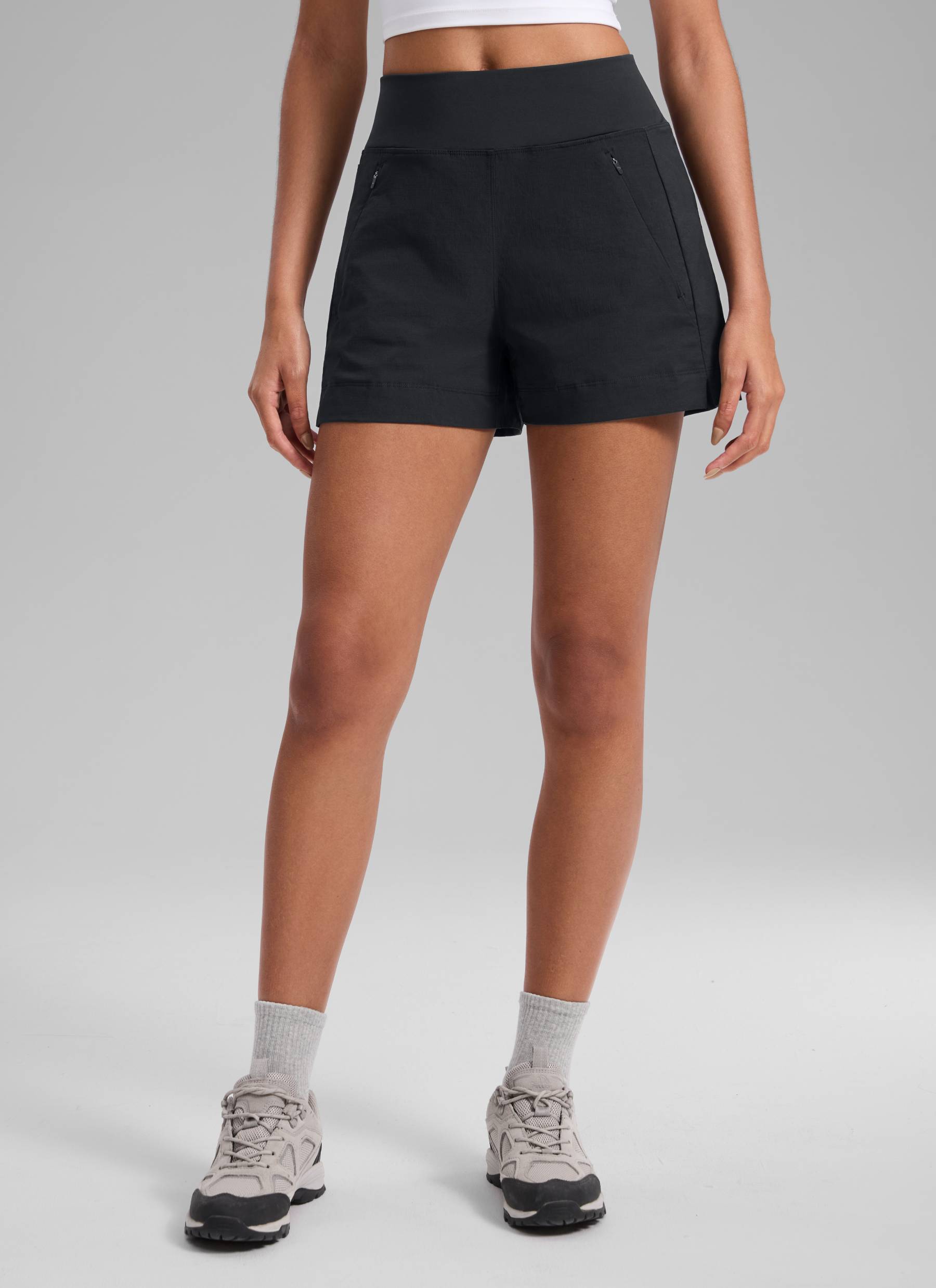 CRZ YOGA Women's Hiking Ripstop Mid-Rise Hiking Shorts Zip Pockets 4'' Black @model_info:Samira