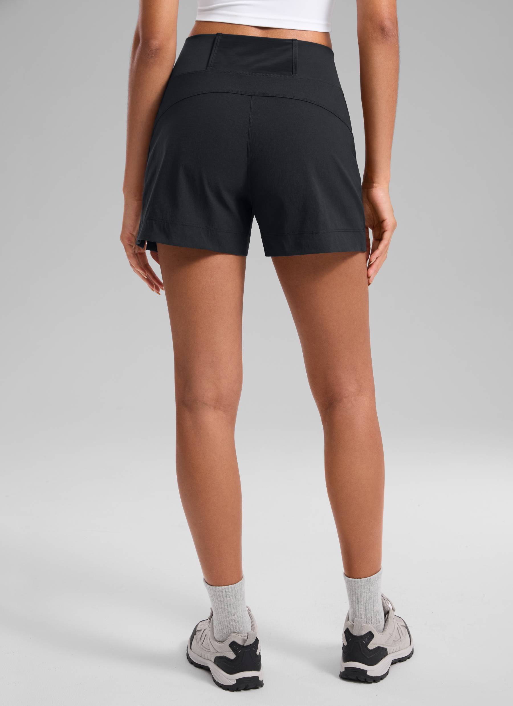 CRZ YOGA Women's Hiking Ripstop Mid-Rise Hiking Shorts Zip Pockets 4'' Black @model_info:Samira