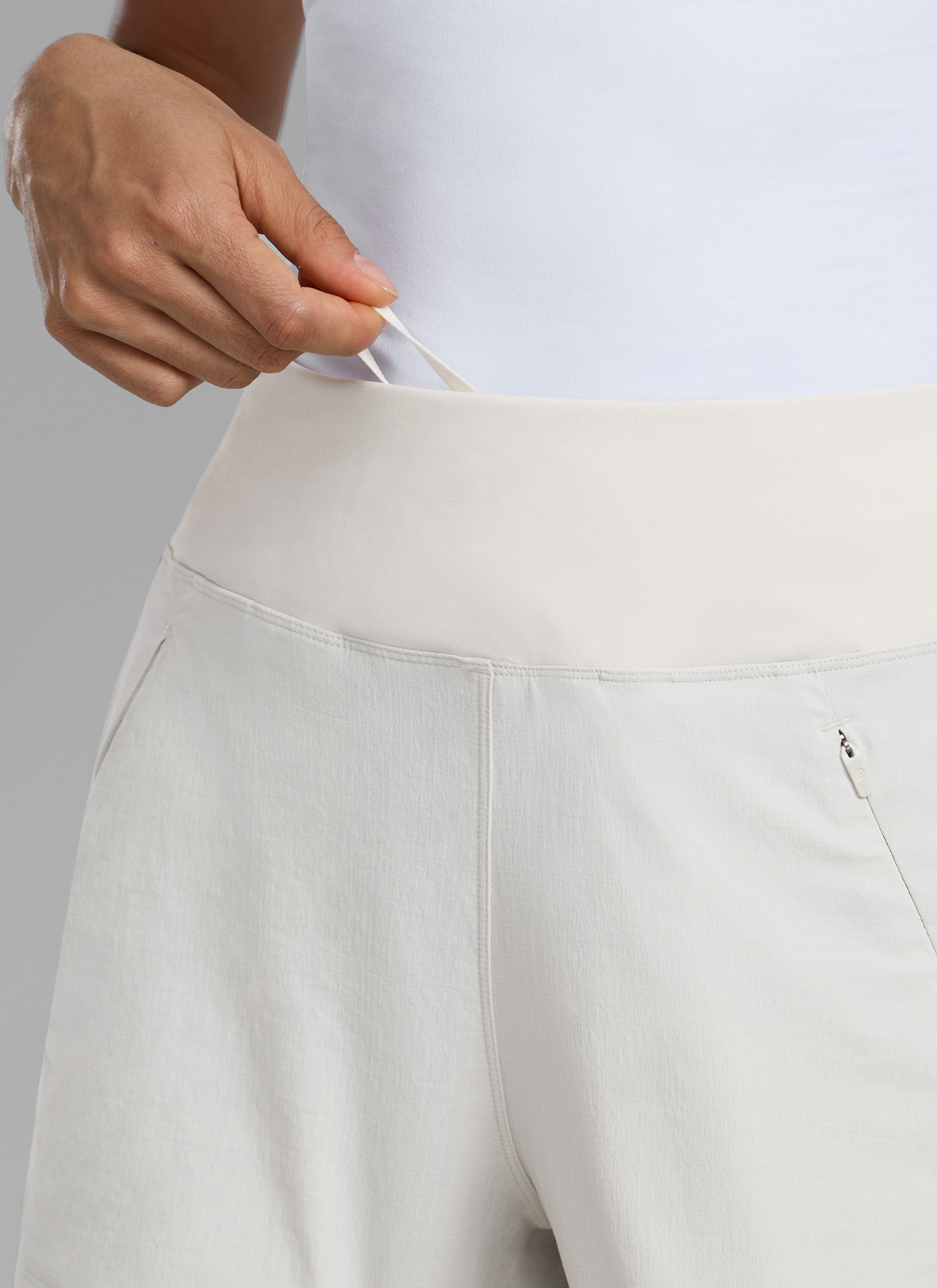 CRZ YOGA Women's Hiking Ripstop Mid-Rise Hiking Shorts Zip Pockets 4'' Milky White @model_info:Larissa