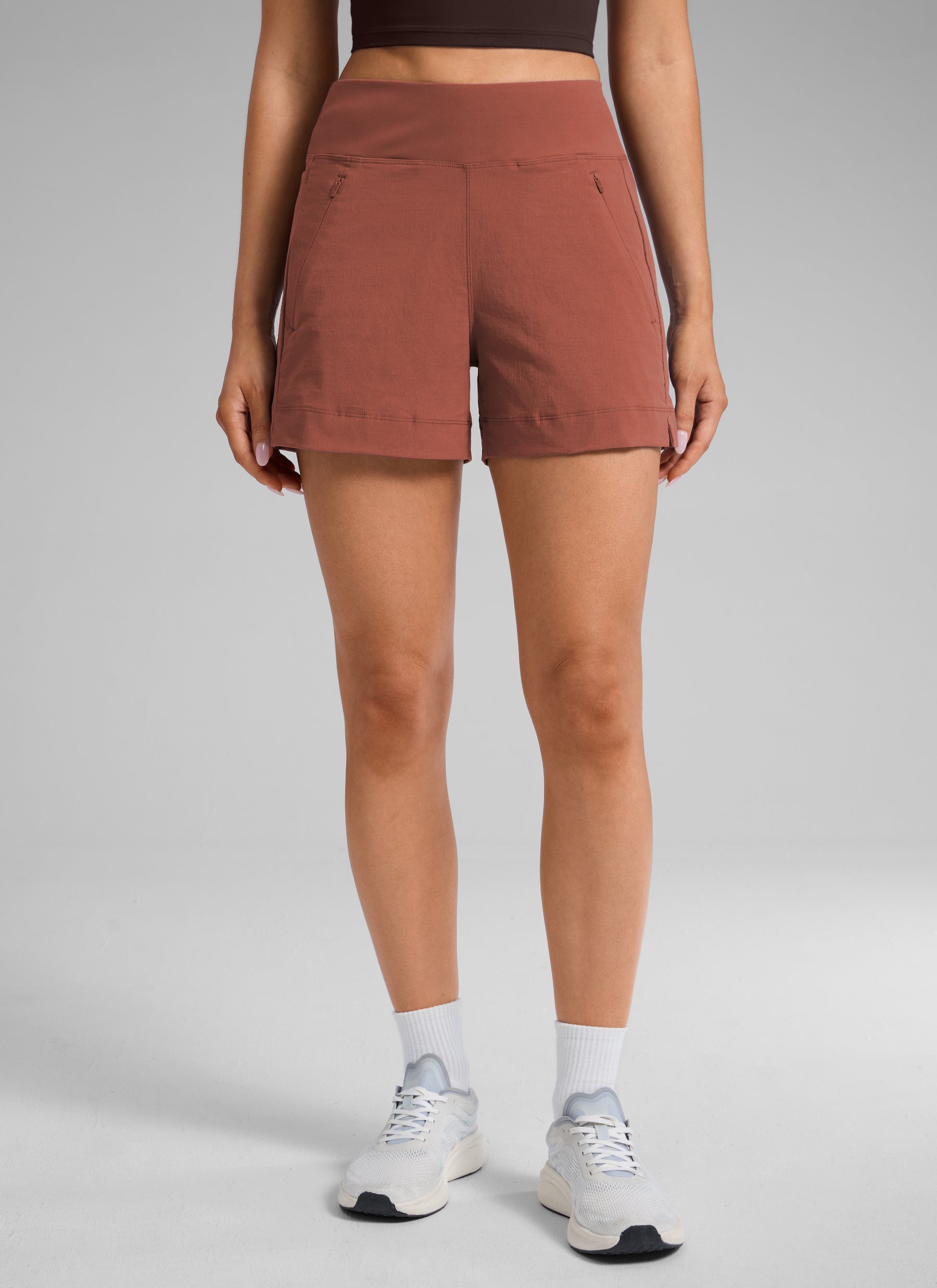 CRZ YOGA Women's Hiking Ripstop Mid-Rise Hiking Shorts Zip Pockets 4'' The Cognac Brown @model_info:S1