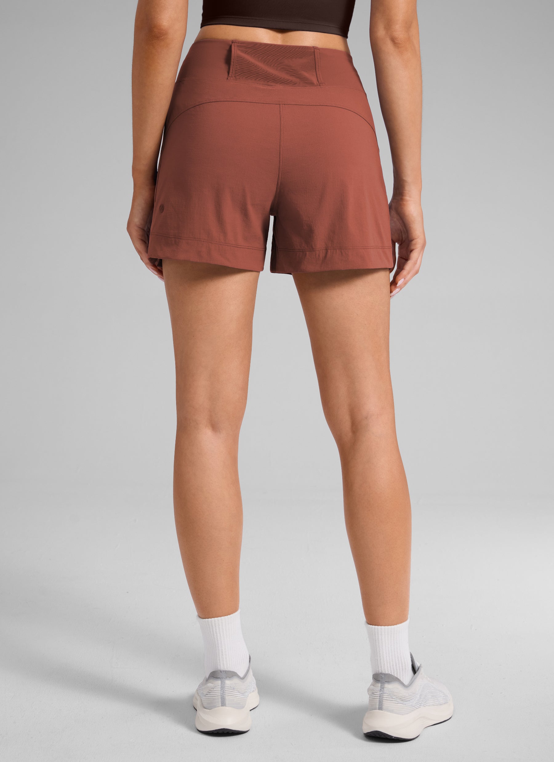 CRZ YOGA Women's Hiking Ripstop Mid-Rise Hiking Shorts Zip Pockets 4'' The Cognac Brown @model_info:S2