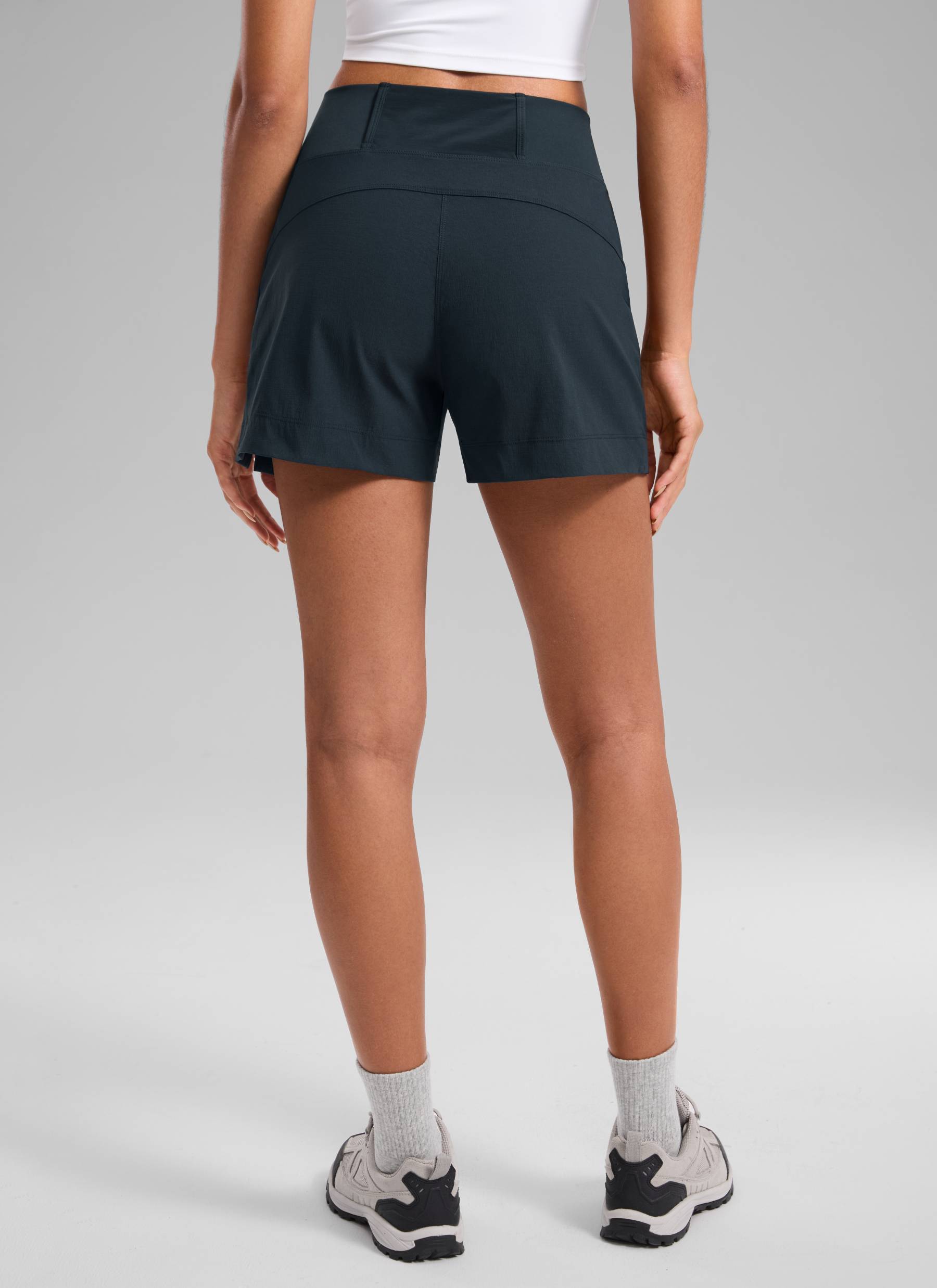 CRZ YOGA Women's Hiking Ripstop Mid-Rise Hiking Shorts Zip Pockets 4'' True Navy @model_info:Samira