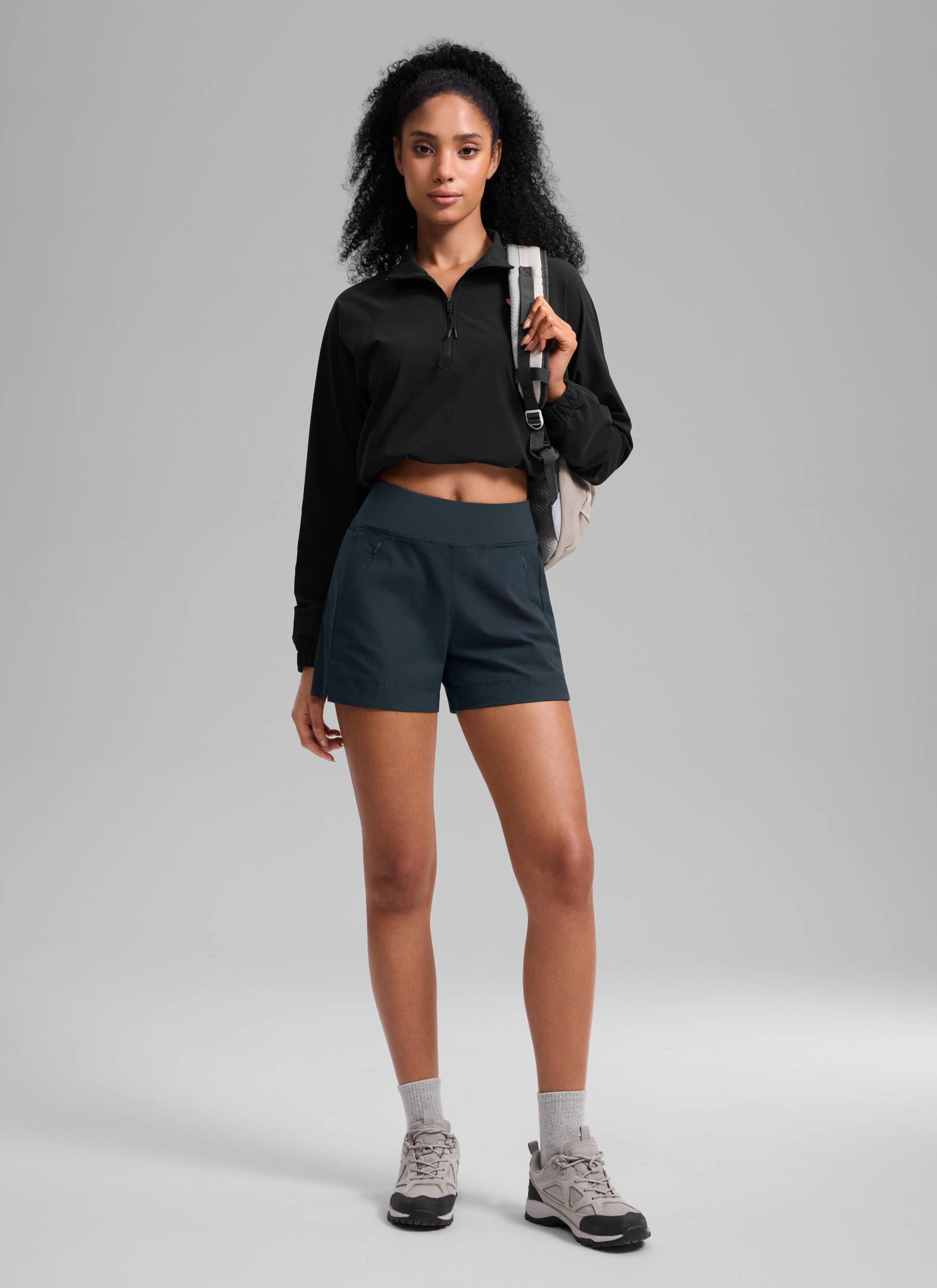 CRZ YOGA Women's Hiking Ripstop Mid-Rise Hiking Shorts Zip Pockets 4'' True Navy @model_info:Samira