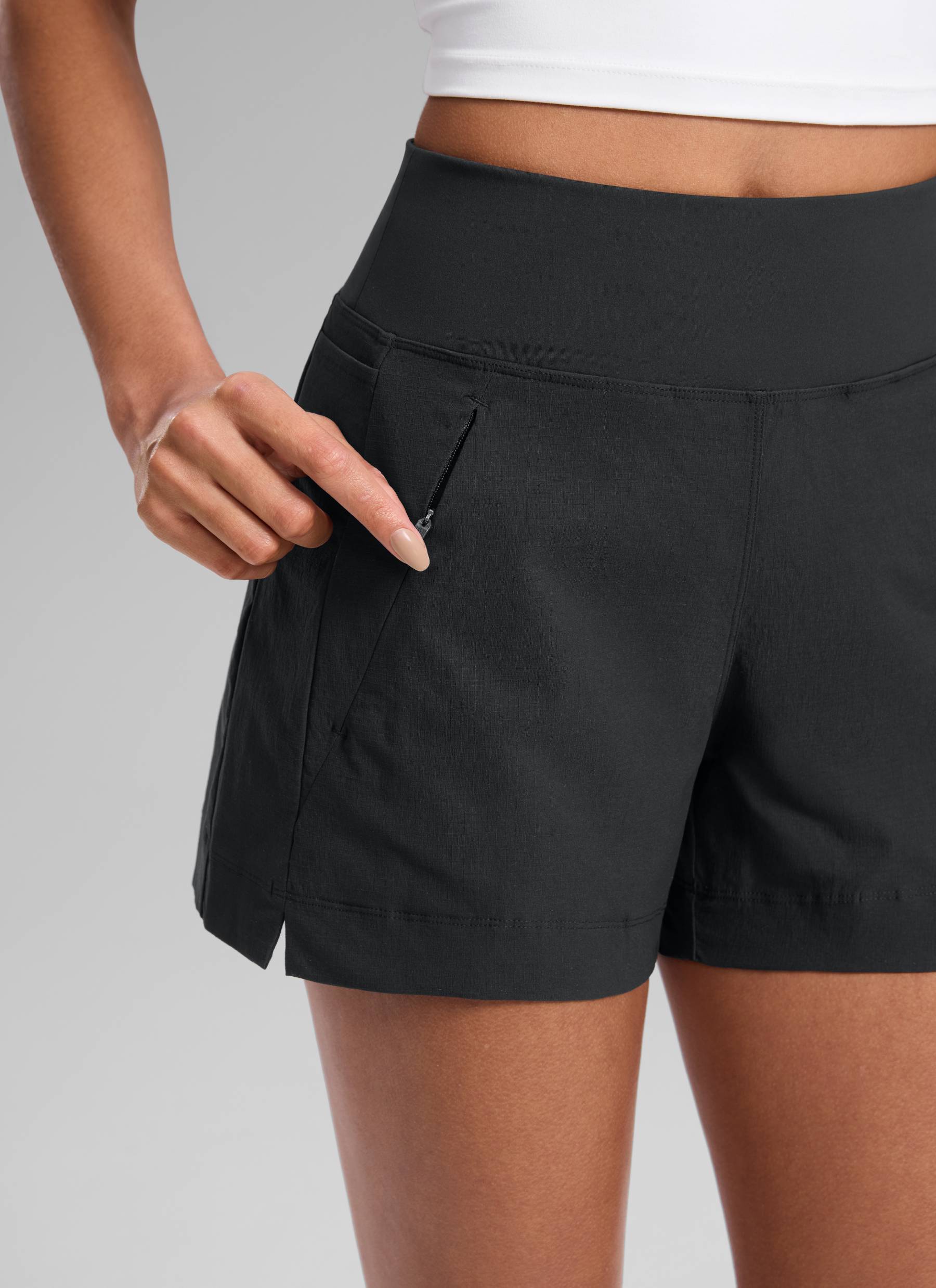 CRZ YOGA Women's Hiking Ripstop Mid-Rise Hiking Shorts Zip Pockets 4'' Ink Gray @model_info:Samira