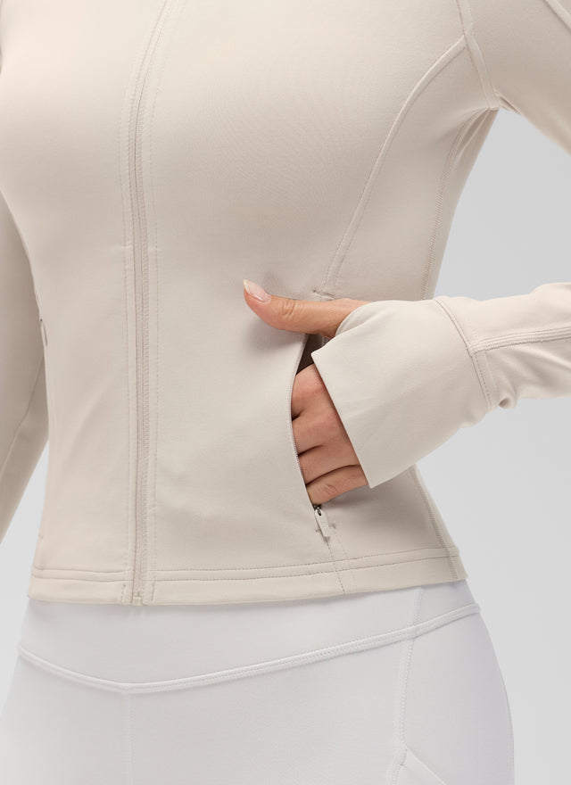 CRZ YOGA Women's Butterluxe Cropped Pocket Outerwear Full Zip Jackets Mojave Tan @model_info:Anna