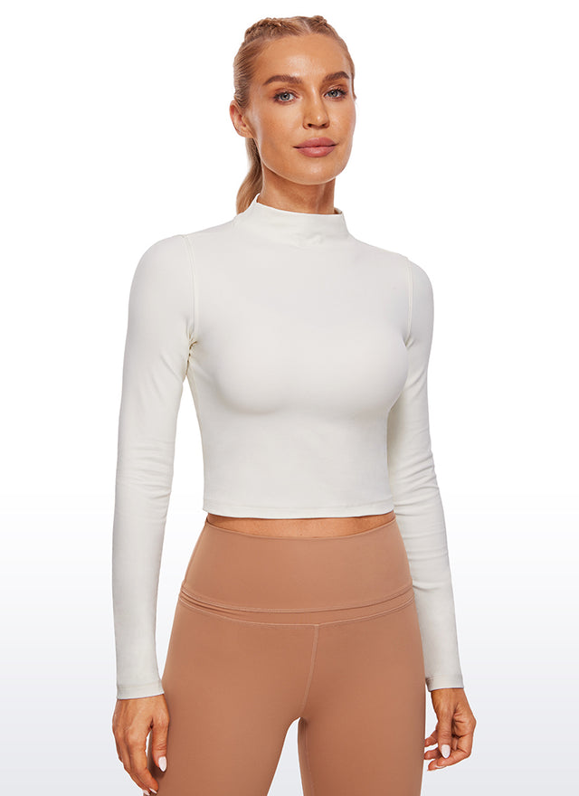 CRZ YOGA Women's Slim Fit Butterluxe Yoga Crop Long Sleeves Mock Turtleneck White Apricot @model_info:NAT
